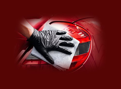 hand-car-wash-attendant-wiping-rear-lights-of-luxury-car-cpv-watford