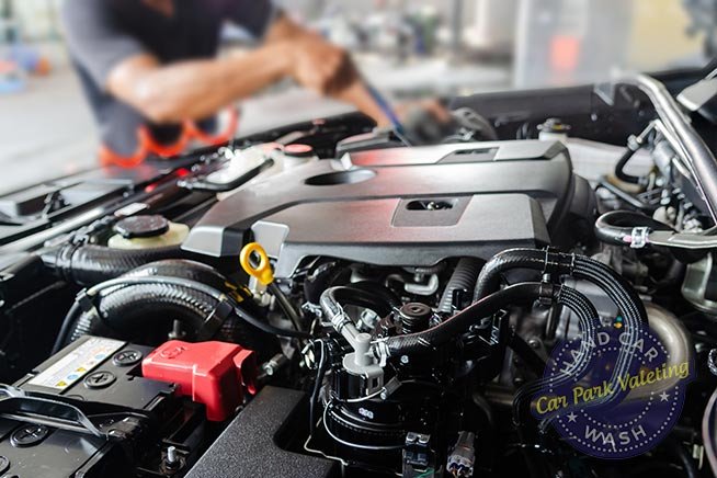 blurred-image-of-man-cleaning-car-engine-in-bay-area