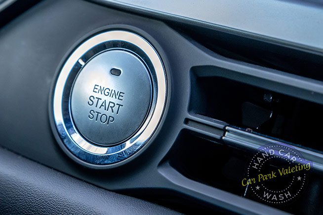 engine-start-stop-button-in-modern-car-close-up-with-cpv-car-wash-logo-watermark