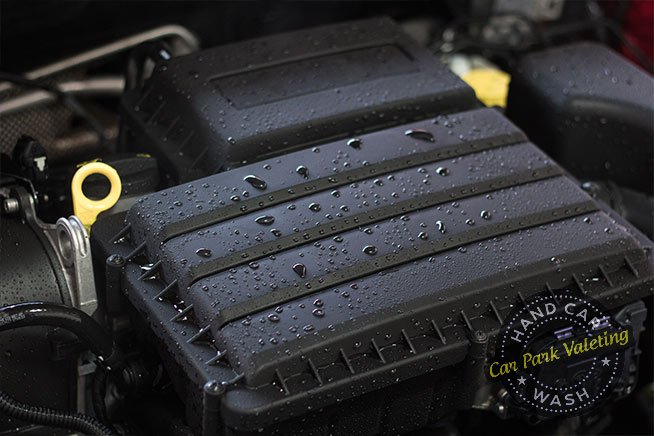 well-cleaned-engine-bay-with-water-residues-on-surface