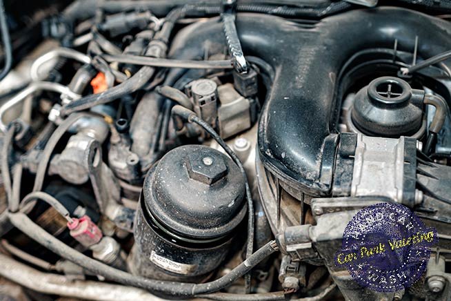 zoom-in-on-dirty-engine-bay-area-of-vehicle-for-how-to-clean-engine-bay-blog