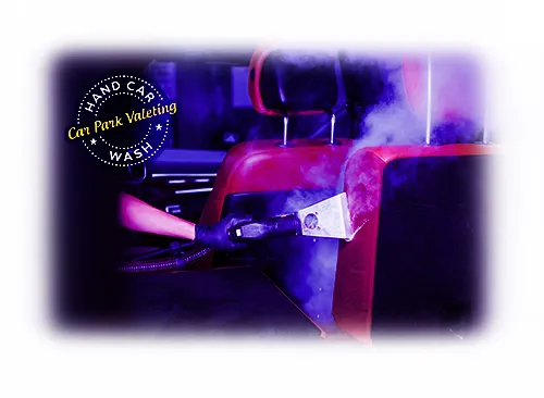 image of car wash attendant cleaning vehicle interior with hand held steam cleaner cpv watford