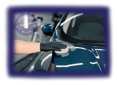 car cleaning professional with black protective glove operating on vehicle with cpv company logo