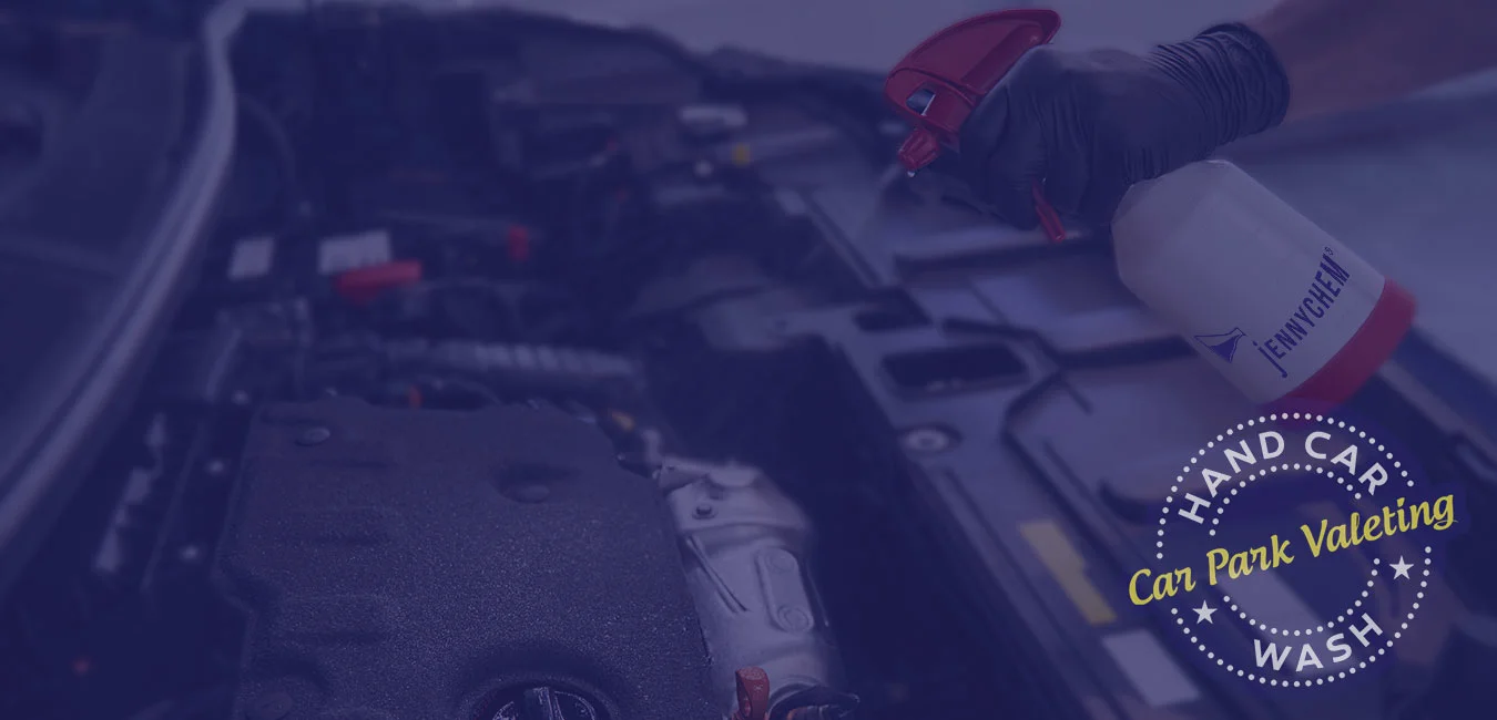 car operative spraying engine bay cleaning detergent into engine bay hero with blue overlay